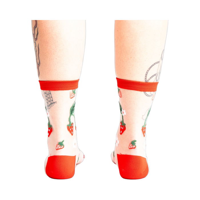 Back view of the strawberry socks, showing the design detail and the red-trimmed ankle.