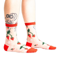 Pair of women's sheer ankle socks with a strawberry and flower design.  Red accents on the cuffs and toes complement the sheer mesh material.