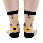 Back view of the sheer sunflower and bee socks, showing the design on the back of the socks.