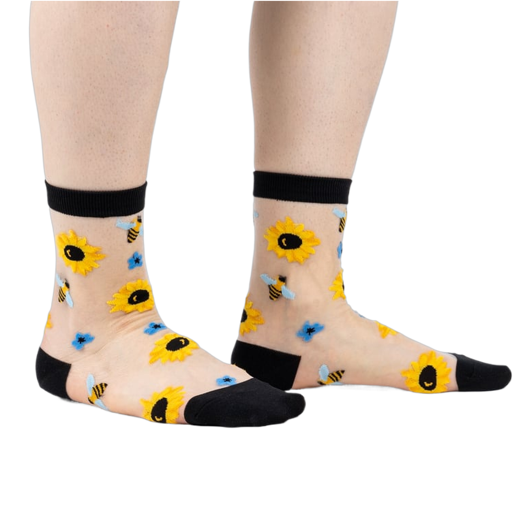 Sheer ankle socks with sunflowers and bees.  Beige background, black cuffs, yellow sunflowers, and blue bees.