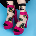 [lf] Sheer socks with black cats and green plants, paired with hot pink platform heels.