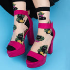 [lf] Sheer socks with black cats and green plants, paired with hot pink platform heels.