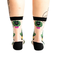 Rear view of the socks on a person's legs, emphasizing the back design.