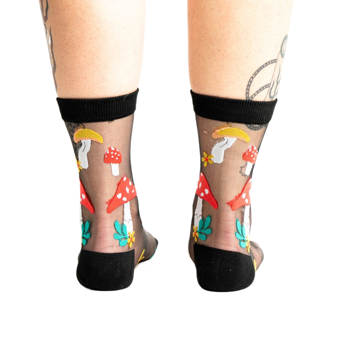 Back view of the 'Made of Magic' mushroom socks, showcasing the design on the heel and sides.