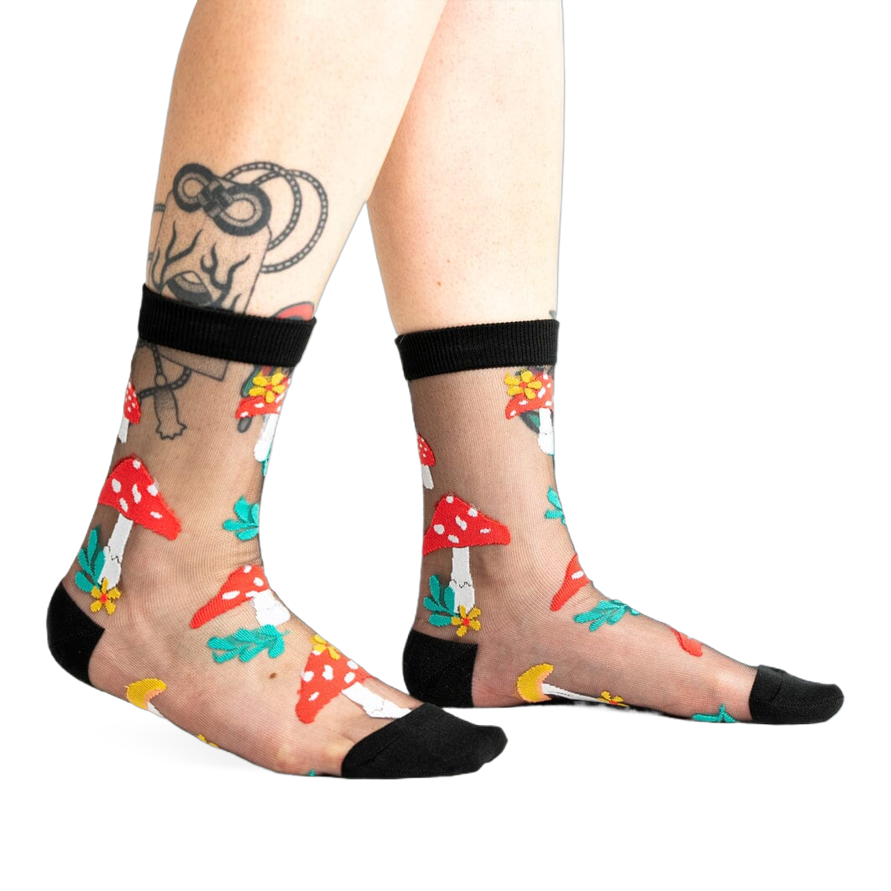 A pair of women's black sheer ankle socks adorned with red and white mushroom and flower designs. 