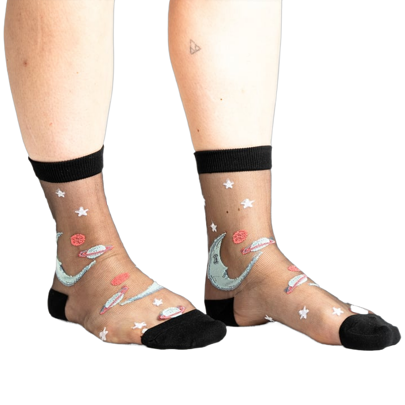 Pair of black sheer ankle socks with a whimsical design featuring a crescent moon, planets, and stars in shades of teal and coral.