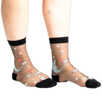 Pair of black sheer ankle socks with a whimsical design featuring a crescent moon, planets, and stars in shades of teal and coral.