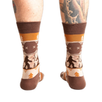 Rear view of the Bigfoot socks on a person's legs.