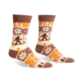 Brown, beige, and orange crew socks with a Bigfoot Fair Isle pattern.  Snowflakes and trees add to the wintery design.