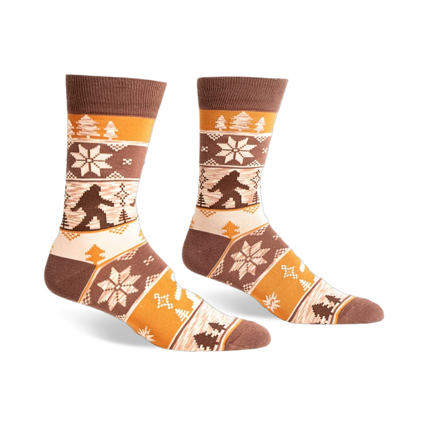 Brown, beige, and orange crew socks with a Bigfoot Fair Isle pattern.  Snowflakes and trees add to the wintery design.