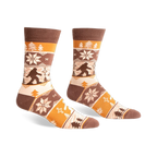 Brown, beige, and orange crew socks with a Bigfoot Fair Isle pattern.  Snowflakes and trees add to the wintery design.