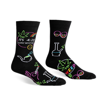 Black crew socks with a fun, colorful design featuring cannabis leaves, bongs, and the phrase 'It's 4:20 Somewhere'.