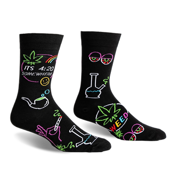 front view of two black socks with colorful marijuana themed designs. one sock has a marijuana leaf, the words gç£its 4:20 somewheregç¥, a rainbow, a smiley face, a smoking pipe, a hand holding a joint and a bong. the other sock has a bong, a marijuana leaf with the word gç£weedgç¥, a pair of glasses with red eyes, and a marijuana leaf.