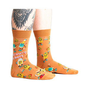 Lifestyle shot of a person wearing the 'Don't Worry, Be Hoppy' socks.