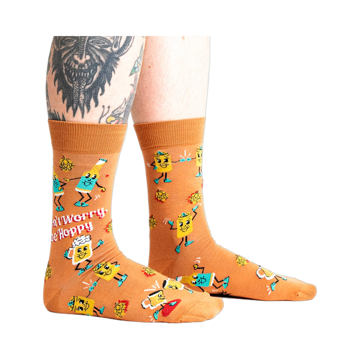 Lifestyle shot of a person wearing the 'Don't Worry, Be Hoppy' socks.
