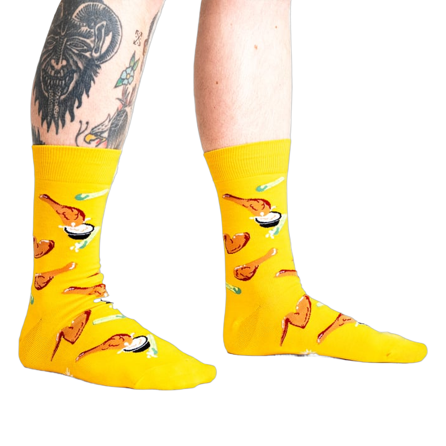 Lifestyle shot of a person wearing the yellow fried chicken socks.