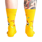 Rear view of the yellow fried chicken socks on a person's legs.