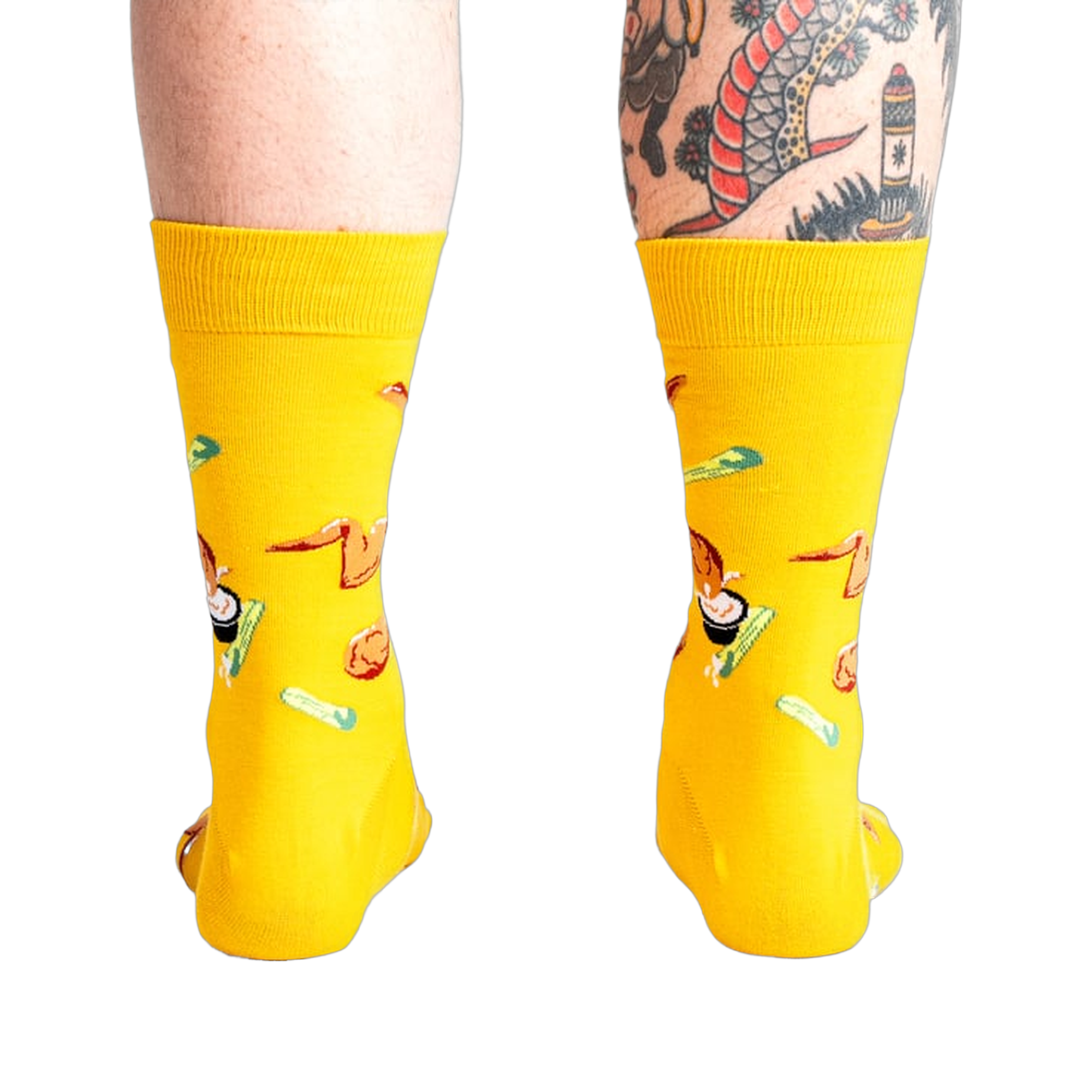 Rear view of the yellow fried chicken socks on a person's legs.