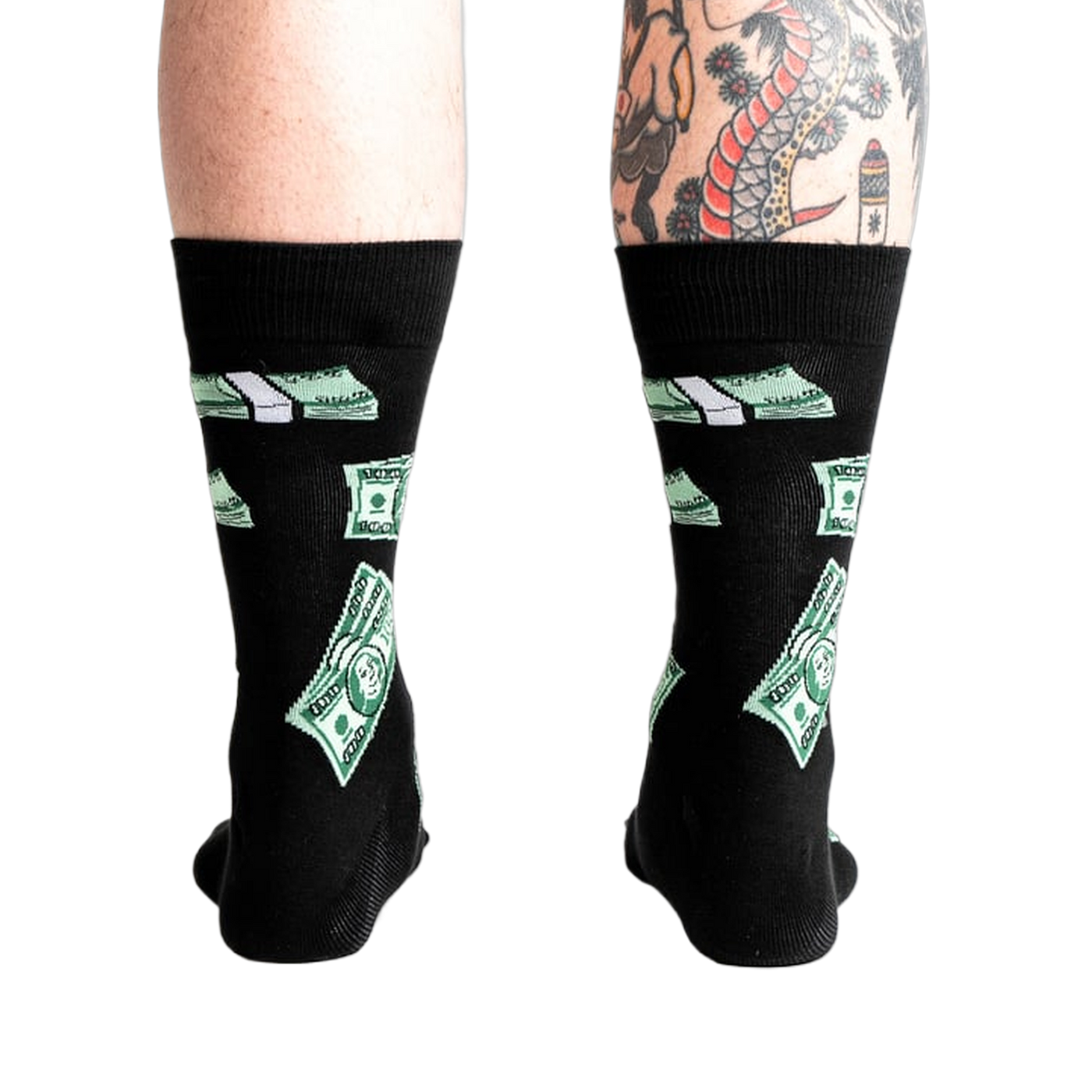 Rear view of the black crew socks with green $100 bill pattern on a model's legs.