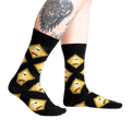 Lifestyle shot of 'Pirate Crossing' socks on a model's legs, showcasing the fit and design on the feet.