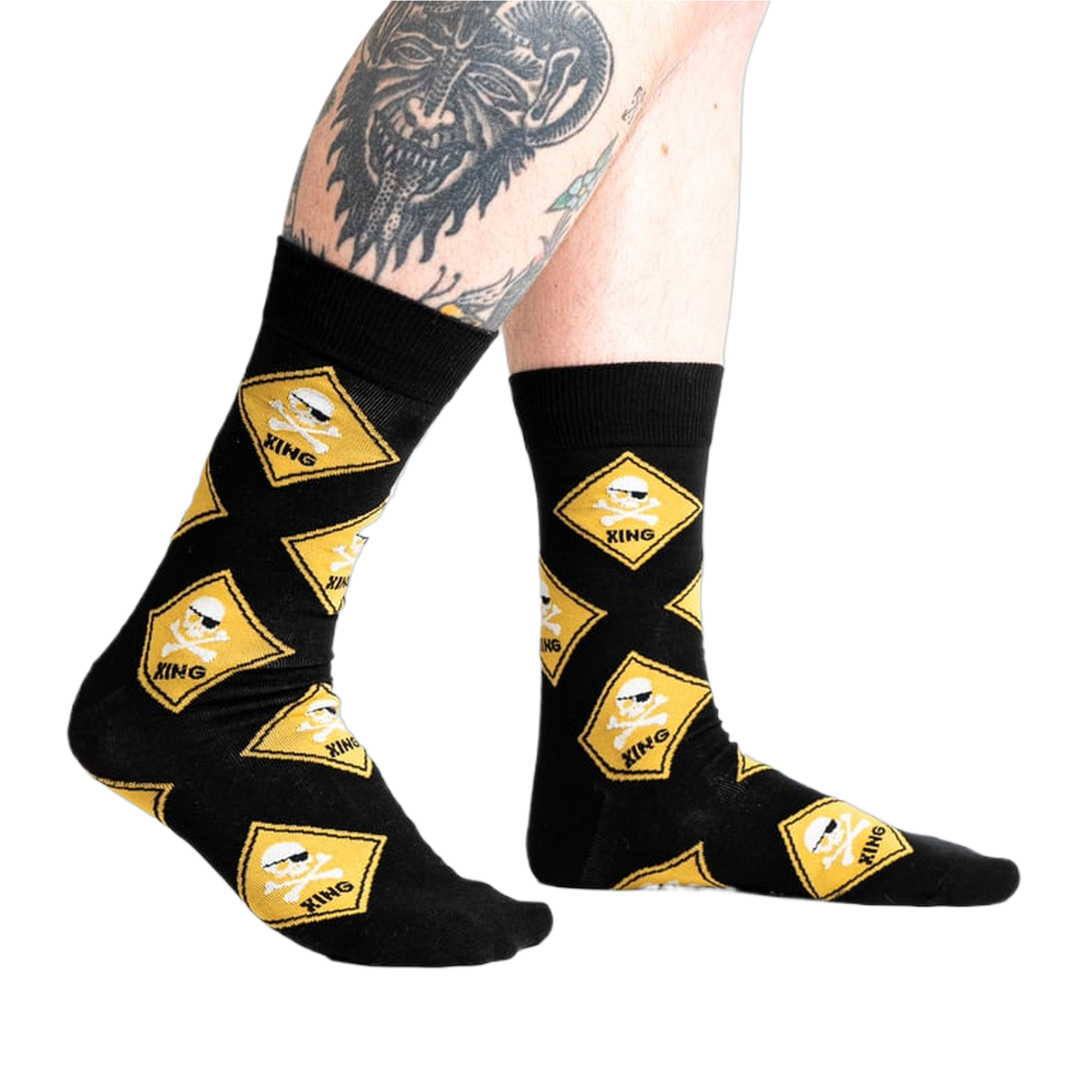 Lifestyle shot of 'Pirate Crossing' socks on a model's legs, showcasing the fit and design on the feet.