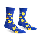 Pair of blue crew socks with yellow rubber ducks wearing sunglasses and bow ties, surrounded by white bubbles.