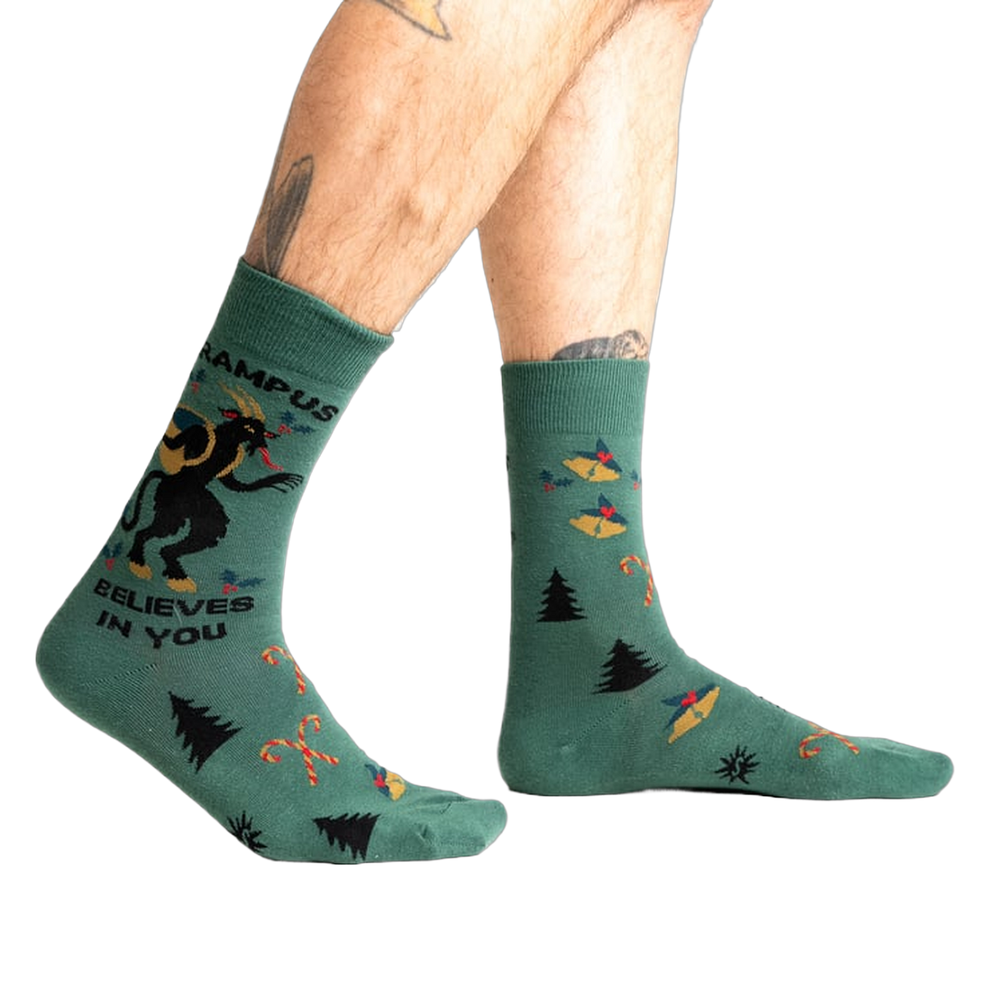 Lifestyle shot showing Krampus Believes in You socks on a person's legs.