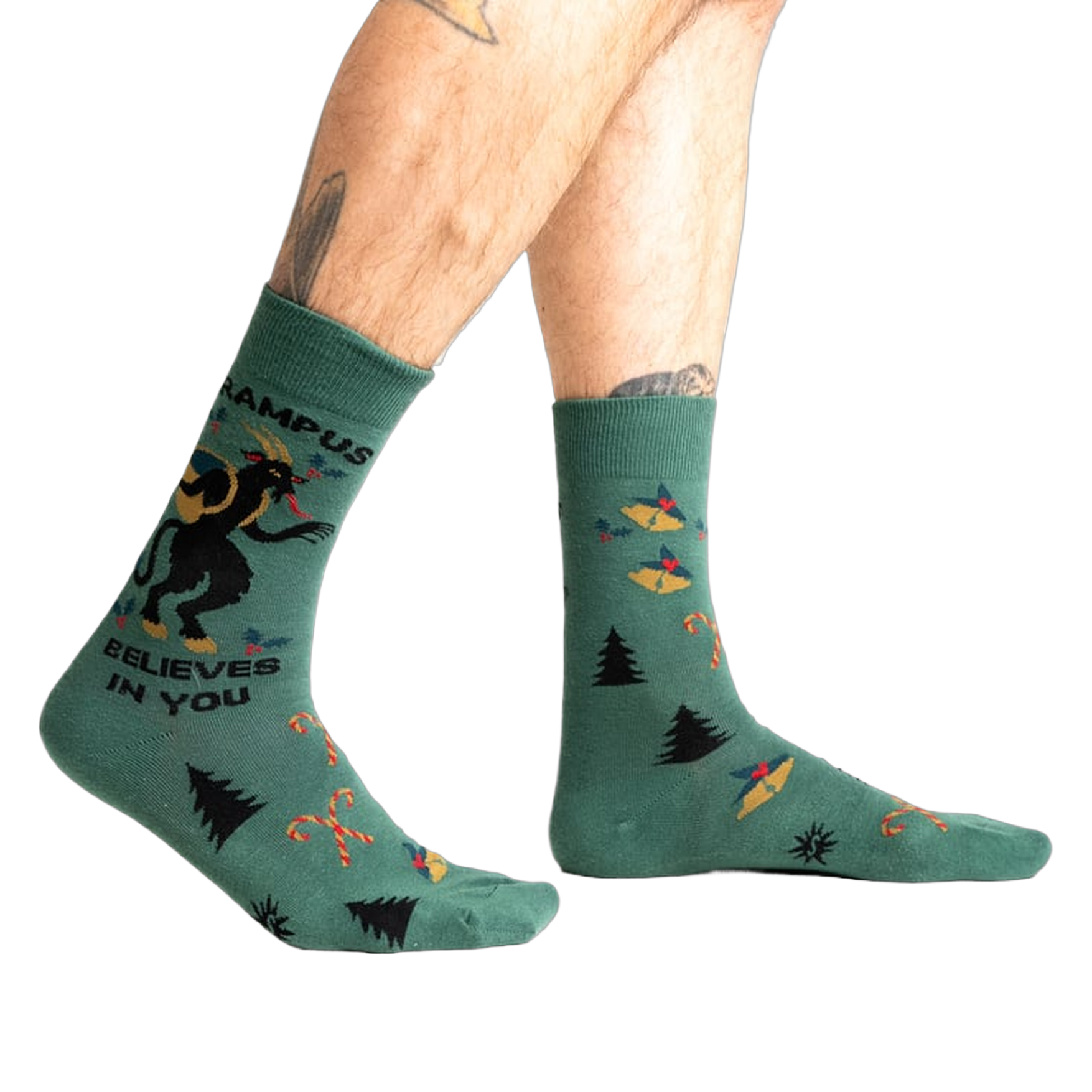 Lifestyle shot showing Krampus Believes in You socks on a person's legs.