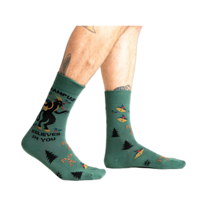 Lifestyle shot showing Krampus Believes in You socks on a person's legs.