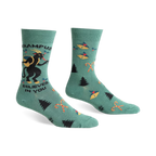 Green crew socks with a Krampus design, candy canes, and Christmas trees.  Features black and red accents.