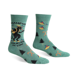 Green crew socks with a Krampus design, candy canes, and Christmas trees.  Features black and red accents.