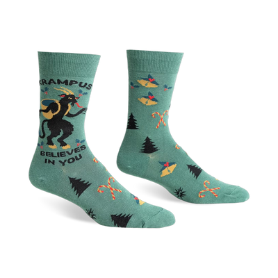 Green crew socks with a Krampus design, candy canes, and Christmas trees.  Features black and red accents.