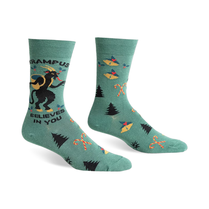 Green crew socks with a Krampus design, candy canes, and Christmas trees.  Features black and red accents.
