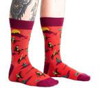 Lifestyle shot showing the 'Jolly Rancher' socks on a model's legs, showcasing the fit and overall look.