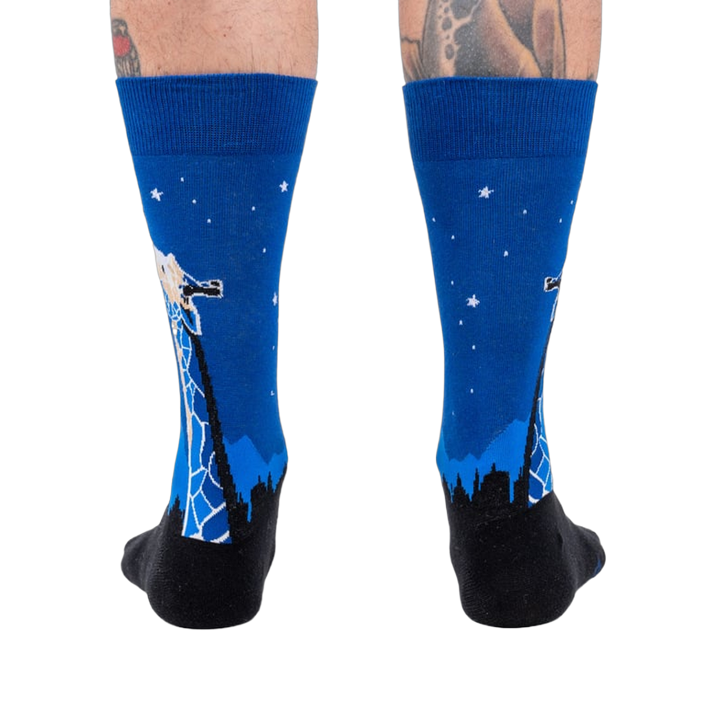 Rear view of 'Stand Tall' socks on a person's legs.