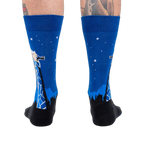 Rear view of 'Stand Tall' socks on a person's legs.