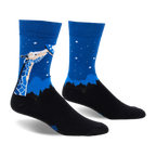 Pair of blue and black crew socks. Design features a giraffe looking up at a UFO against a night sky with stars and a silhouetted landscape.