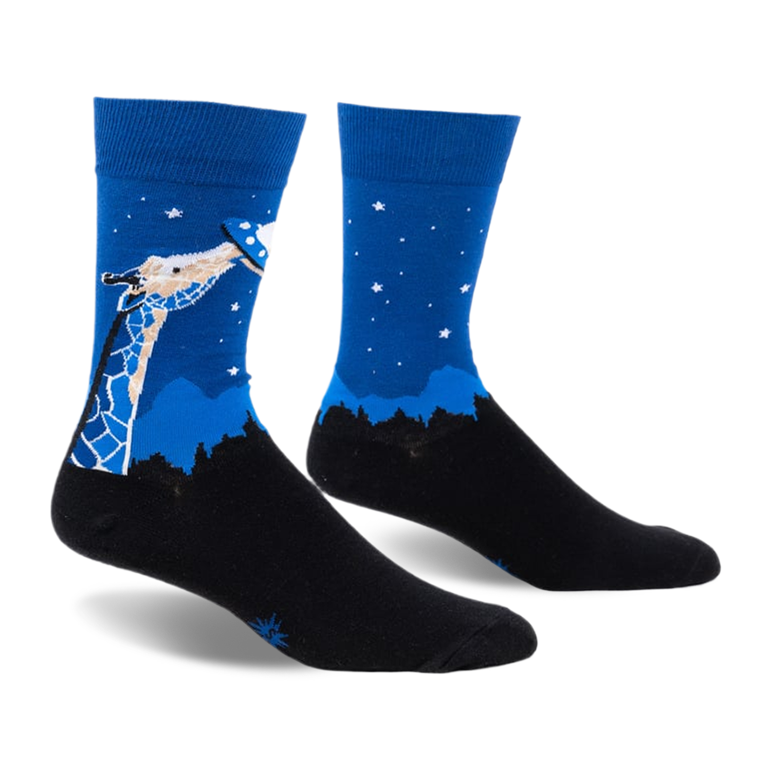Pair of blue and black crew socks. Design features a giraffe looking up at a UFO against a night sky with stars and a silhouetted landscape.