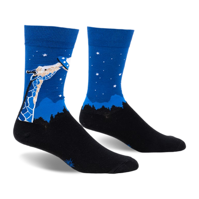 front view of a pair of blue socks with a giraffe reaching up to a flying saucer. the background is blue with white stars. the socks are on a white background.