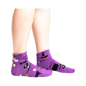 Lifestyle shot: Model wearing the purple 'Witch, Please' socks, showcasing the fit and style.