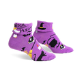 Pair of purple crew socks with a Halloween design. Features black bats, a witch's hat, cauldron, and the text 'Witch, Please'.