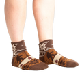Lifestyle shot of model wearing Bigfoot Lebowski socks.