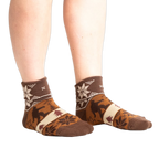 Lifestyle shot of model wearing Bigfoot Lebowski socks.