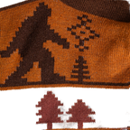 Close-up detail shot showcasing the Bigfoot and tree design on the socks.