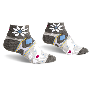 pair of gray, white, blue and yellow socks with snowflake pattern. the socks are ankle-high. the socks are laid flat, side view.