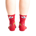 Rear view of the socks on a person's feet, highlighting the design on the back of the socks.