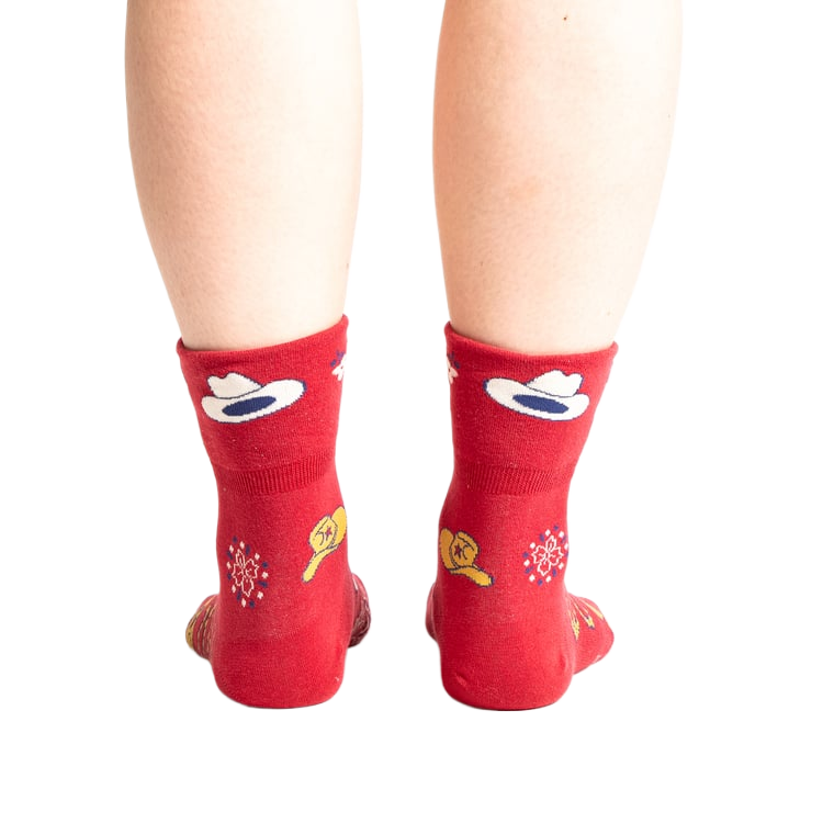 Rear view of the socks on a person's feet, highlighting the design on the back of the socks.