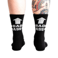 Pair of black ribbed athletic socks with white "BAD ASS" text and upward arrow graphic.