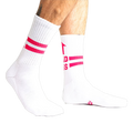 Lifestyle shot showing white Bad Ass Athletic Ribbed socks on a person's legs.