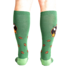 Rear view of a person wearing the 'S'more Where That Came From' knee-high socks, showing the full design on both socks.